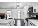 Well-appointed kitchen with stainless steel appliances, and an island open to the living area at 6036 Terrytown Pkwy, Indianapolis, IN 46254