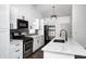Beautiful kitchen with modern appliances, granite countertops, and a stylish faucet at 6036 Terrytown Pkwy, Indianapolis, IN 46254