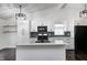 Updated kitchen featuring a large island, white cabinets, and modern black hardware at 6036 Terrytown Pkwy, Indianapolis, IN 46254