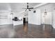 Open-concept living space featuring hardwood floors, modern lighting, and a kitchen island at 6036 Terrytown Pkwy, Indianapolis, IN 46254
