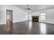 Large living room with a fireplace, hardwood floors, and abundant natural light at 6036 Terrytown Pkwy, Indianapolis, IN 46254