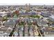 Stunning aerial view of colorful townhomes and the city skyline providing a vibrant community setting at 634 N Senate Ave, Indianapolis, IN 46202
