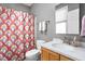 Bathroom featuring modern fixtures, a colorful shower curtain, and a clean, bright design at 634 N Senate Ave, Indianapolis, IN 46202