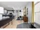 An open-concept living room with light hardwood floors and contemporary decor showcases a seamless blend of style and comfort at 634 N Senate Ave, Indianapolis, IN 46202