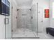 A luxurious walk-in shower features elegant tile work, a glass enclosure, and modern fixtures at 634 N Senate Ave, Indianapolis, IN 46202