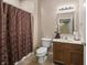 Cozy bathroom featuring a vanity, toilet, shower with curtain, and an overhead light at 639 Nuttal St, Westfield, IN 46074