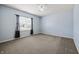 Spacious bedroom with plush carpet, ceiling fan, and natural light from a bright sunny window at 639 Nuttal St, Westfield, IN 46074