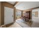 Dining area showcasing a round wood table, a large wood china cabinet, and natural light from the nearby window at 639 Nuttal St, Westfield, IN 46074