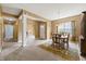 Formal dining room with a round table, wood chairs, a large china cabinet, and an adjacent sitting room at 639 Nuttal St, Westfield, IN 46074