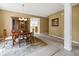 Dining room features a wood table and chairs, a china cabinet, and is located adjacent to the living room and kitchen at 639 Nuttal St, Westfield, IN 46074