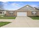 Charming brick home with a wide driveway and attached two-car garage, showcasing inviting curb appeal at 639 Nuttal St, Westfield, IN 46074