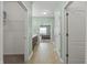 Bright hallway featuring access to a walk-in closet, bathroom vanity, and view to a bedroom with natural light at 639 Nuttal St, Westfield, IN 46074