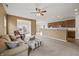 Inviting living room with neutral carpet, a comfortable sofa and chair, and an open layout to the kitchen at 639 Nuttal St, Westfield, IN 46074
