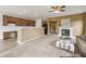 Open-concept living room features a fireplace, ceiling fan, and an adjacent kitchen at 639 Nuttal St, Westfield, IN 46074