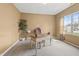 Bright home office featuring a classic wood desk, neutral paint, and a large window for natural light at 639 Nuttal St, Westfield, IN 46074