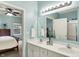 Bright bathroom featuring a double sink vanity and access to the Primary bedroom at 661 Overcup St, Westfield, IN 46074