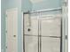 Bathroom featuring a glass-enclosed shower and white tile at 661 Overcup St, Westfield, IN 46074