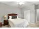 Cozy bedroom featuring neutral paint, carpet, ceiling fan, and a double door closet at 661 Overcup St, Westfield, IN 46074