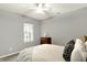 This bedroom features neutral colors, carpet, a window, and a ceiling fan at 661 Overcup St, Westfield, IN 46074