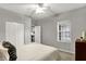 Bedroom with neutral walls, carpet, and white trim has closet and window with blinds at 661 Overcup St, Westfield, IN 46074