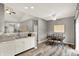 Open dining area features hardwood floors and an adjacent kitchen at 661 Overcup St, Westfield, IN 46074