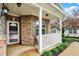 Inviting front porch with white railing, decorative plants, and a cozy welcome mat at 661 Overcup St, Westfield, IN 46074