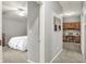 Hallway view leading to a bedroom and an office area with built-in cabinets at 661 Overcup St, Westfield, IN 46074