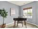Serene home office with a modern desk, natural light, and minimalist decor for a productive workspace at 661 Overcup St, Westfield, IN 46074