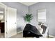 Home office featuring grey walls, modern desk, and a cozy chair, with view to the hallway at 661 Overcup St, Westfield, IN 46074