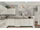 Updated kitchen with stainless steel appliances, white cabinets, and granite countertops at 661 Overcup St, Westfield, IN 46074