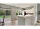 Well-lit kitchen with stainless steel appliances, neutral paint, and sliding door access to backyard at 661 Overcup St, Westfield, IN 46074
