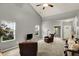 Open living room featuring neutral tones, vaulted ceiling, carpet and comfortable leather furniture at 661 Overcup St, Westfield, IN 46074
