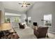 Spacious living area features plenty of natural light and cozy leather chairs at 661 Overcup St, Westfield, IN 46074