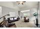 Inviting living room boasts high ceilings, neutral paint, and comfortable leather seating at 661 Overcup St, Westfield, IN 46074