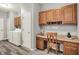 This office features built in cabinets, a desk, and neutral colored walls at 661 Overcup St, Westfield, IN 46074