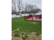 The backyard features a deck, a shed, and ample green space for outdoor activities at 7497 Grandview Dr, Avon, IN 46123