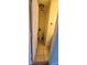 Cozy half-bathroom featuring a standard toilet and a small decorative plant shelf at 7497 Grandview Dr, Avon, IN 46123