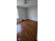 This bedroom features new wood flooring, a window for natural light, and neutral walls at 7497 Grandview Dr, Avon, IN 46123