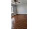This bedroom features new wood flooring, a window for natural light, and neutral walls at 7497 Grandview Dr, Avon, IN 46123