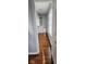 Walk-in closet featuring wood flooring and a window for natural light, with storage space at 7497 Grandview Dr, Avon, IN 46123