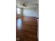 Spacious living room featuring hardwood flooring, updated lighting, and a bright, airy ambiance at 7497 Grandview Dr, Avon, IN 46123