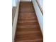 Staircase with hardwood steps and a classic banister, leading to the upper level at 7497 Grandview Dr, Avon, IN 46123