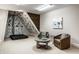 Finished basement featuring climbing wall, padded seating, and modern decor, creating a recreational haven at 768 Trailside Dr, Carmel, IN 46032