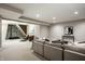Large finished basement with a climbing wall, plush seating, and neutral colors, perfect for recreation and relaxation at 768 Trailside Dr, Carmel, IN 46032