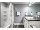 Clean bathroom with tub, shower and a gray granite countertop vanity at 768 Trailside Dr, Carmel, IN 46032