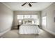 A serene bedroom features soft natural light, a ceiling fan, and neutral tones creating a calming retreat at 768 Trailside Dr, Carmel, IN 46032