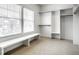 Spacious walk-in closet with natural light, built-in shelving, rods, and a convenient bench at 768 Trailside Dr, Carmel, IN 46032