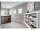 Upstairs hallway featuring a beautiful bookshelf, a chandelier and plenty of natural light at 768 Trailside Dr, Carmel, IN 46032