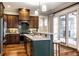 Bright kitchen features granite countertops, stainless steel appliances, a breakfast bar and access to the outdoor patio at 768 Trailside Dr, Carmel, IN 46032