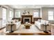Cozy living room with a traditional fireplace and comfortable seating arrangement at 768 Trailside Dr, Carmel, IN 46032